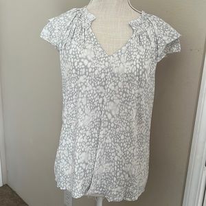 A New Day medium white dot top with the cutest detail on the shoulders!